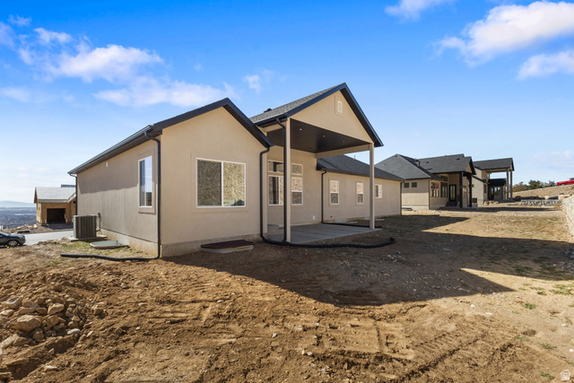 638 East Mountain Road North Ogden, UT 84414 - Photo 26 of 28 Back of house featuring a patio area and stucco siding