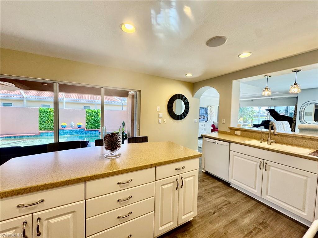 9079 Astonia Way Estero, FL 33967 - Photo 13 of 37 a kitchen with counter top space and a sink