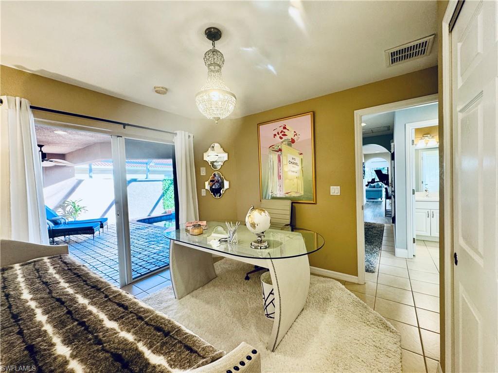 9079 Astonia Way Estero, FL 33967 - Photo 19 of 37 a living room with furniture and a table