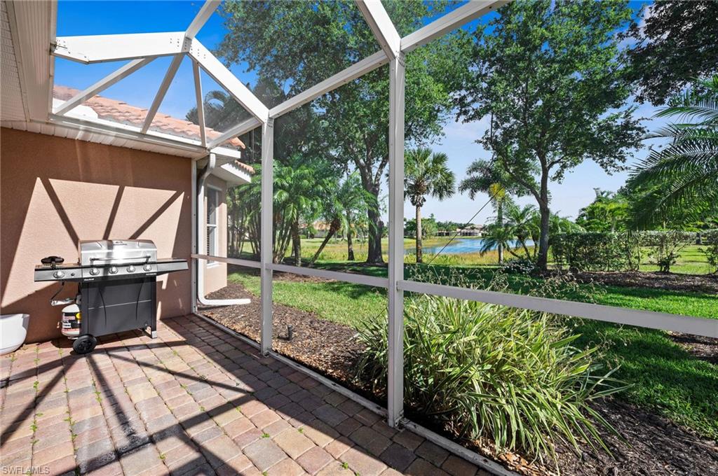 9079 Astonia Way Estero, FL 33967 - Photo 27 of 37 a view of a backyard with sitting area and garden