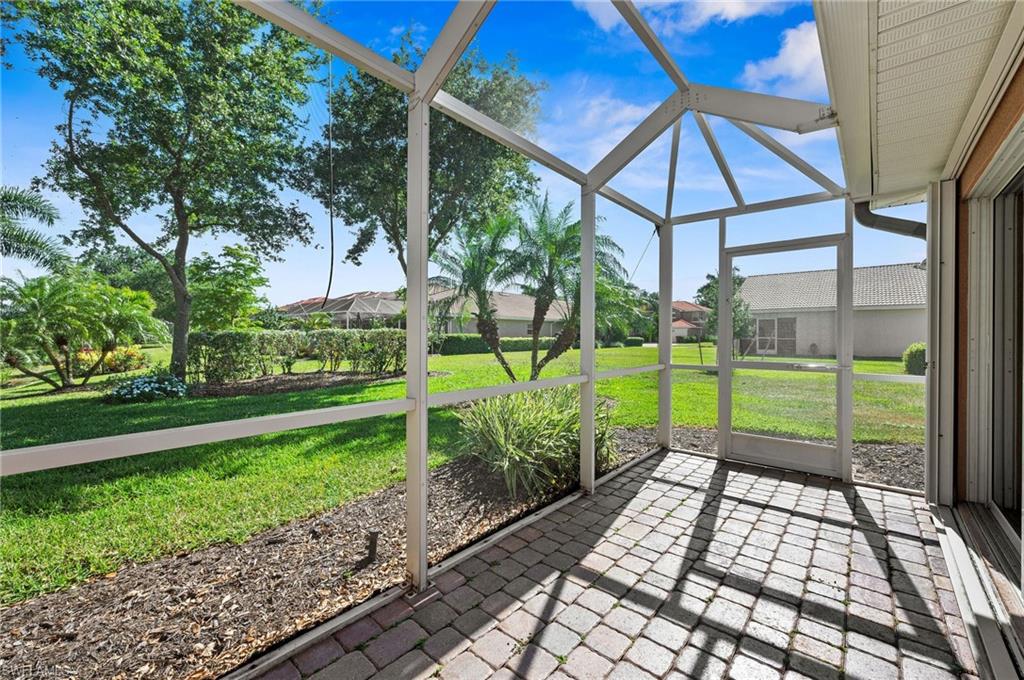 9079 Astonia Way Estero, FL 33967 - Photo 28 of 37 a view of a garden with a large trees