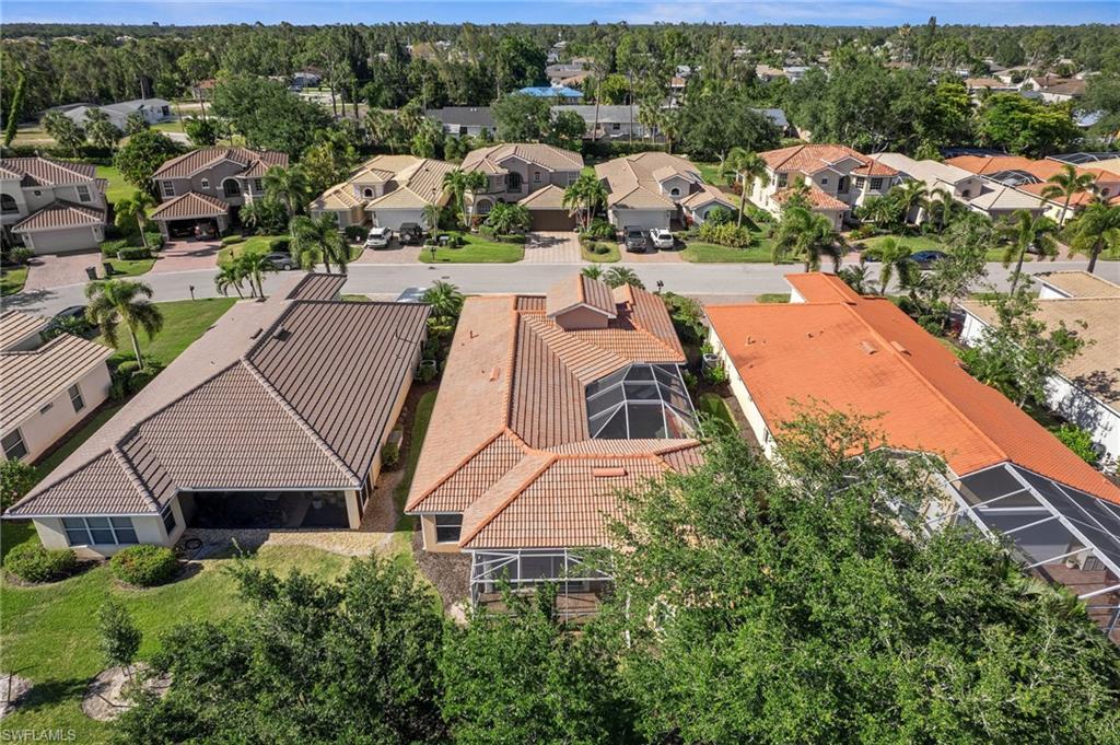 9079 Astonia Way Estero, FL 33967 - Photo 30 of 37 an aerial view of house with yard