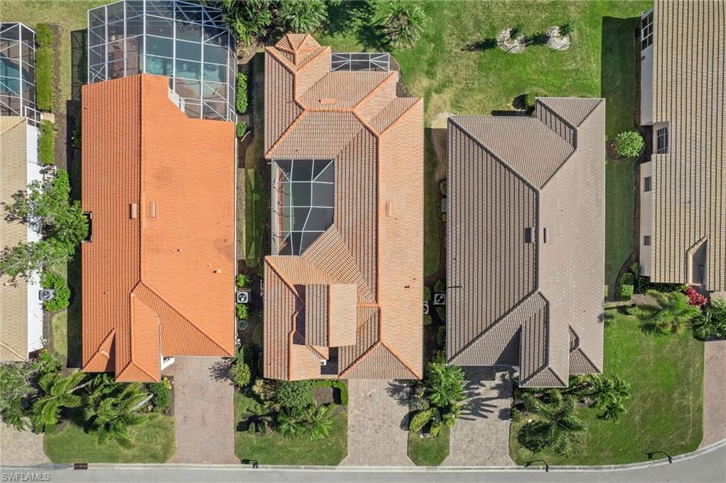 9079 Astonia Way Estero, FL 33967 - Photo 3 of 37 an aerial view of a house with garden space and plants