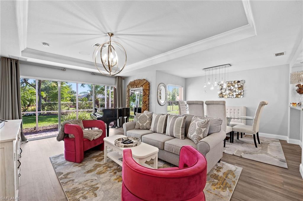 9079 Astonia Way Estero, FL 33967 - Photo 7 of 37 a living room with furniture and a large window