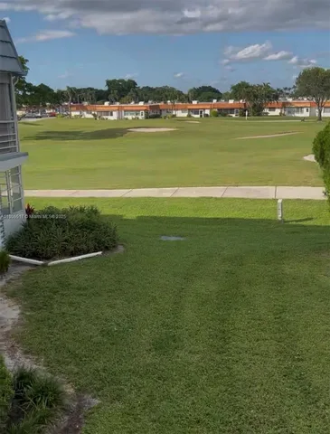 a view of a lake with houses in background