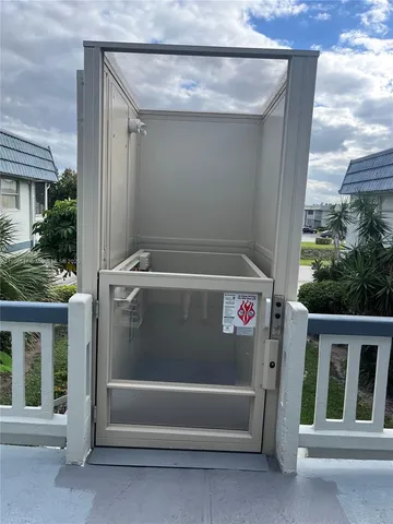 a bathroom with a granite countertop toilet sink and mirror