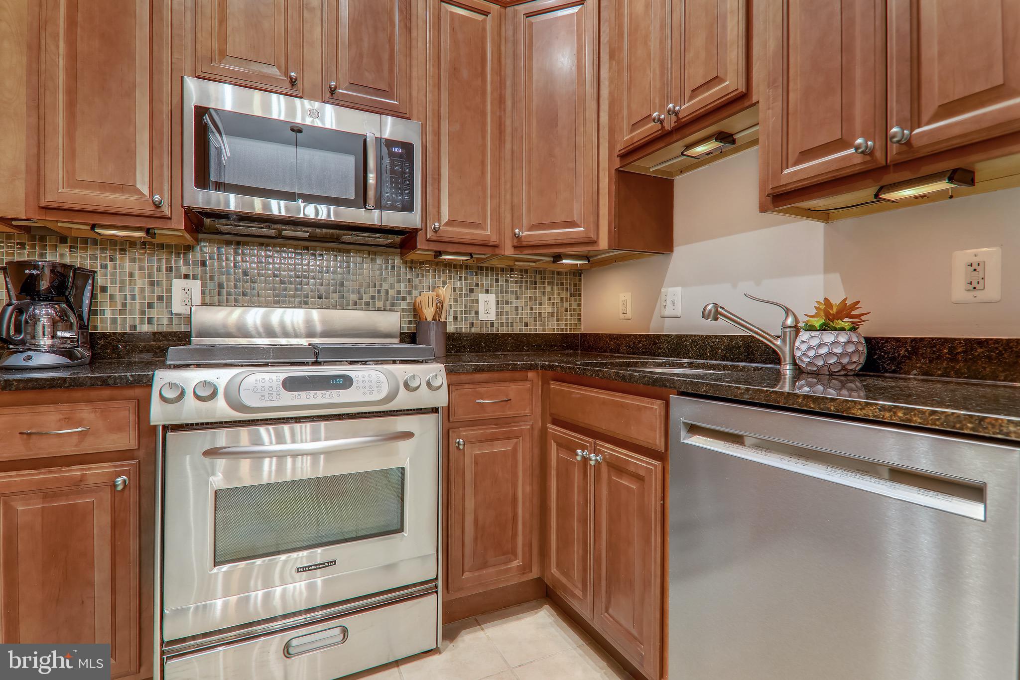 1438 Columbia Road Northwest, Unit 103 Washington, DC 20009 - Photo 15 of 39 Updated kitchen with stainless appliances
