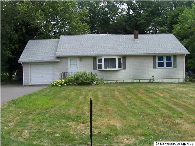 45 Old Mill Road Old Bridge, NJ 07747 - Photo 1 of 3 a front view of a house with garden