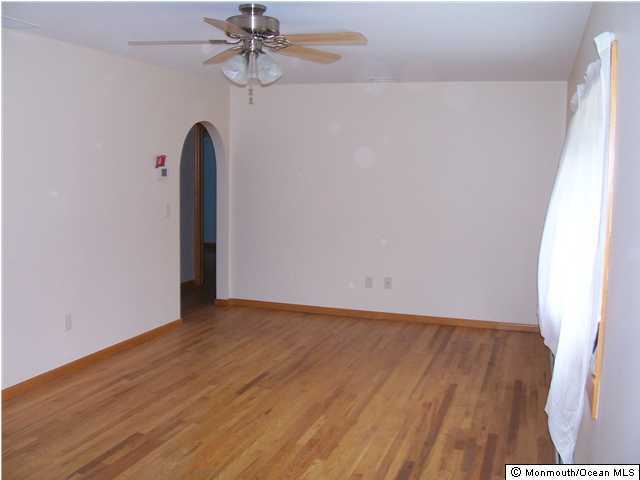 45 Old Mill Road Old Bridge, NJ 07747 - Photo 2 of 3 a view of a room with wooden floor and white walls