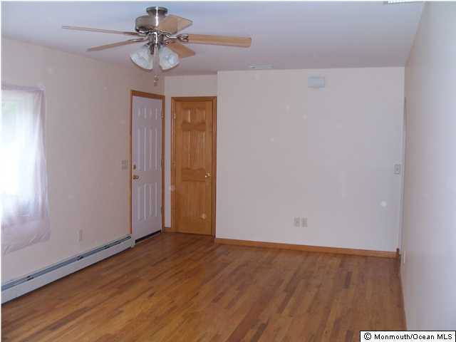 45 Old Mill Road Old Bridge, NJ 07747 - Photo 3 of 3 a view of room with hardwood floor and ceiling fan