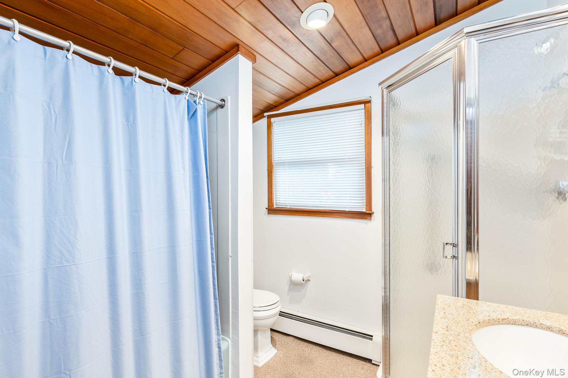 261 Elm Road West Mastic Beach, NY 11951 - Photo 11 of 22 a bathroom with a sink and a mirror