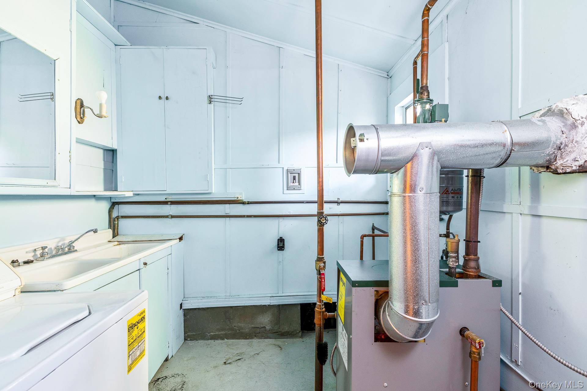 261 Elm Road West Mastic Beach, NY 11951 - Photo 12 of 22 a utility room with a sink dryer and washer