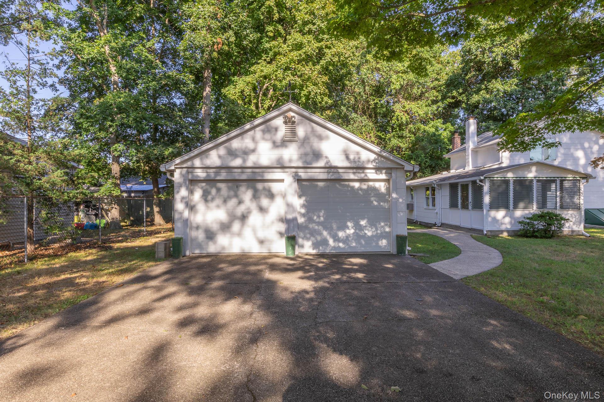 261 Elm Road West Mastic Beach, NY 11951 - Photo 3 of 22 a view of a house with a yard