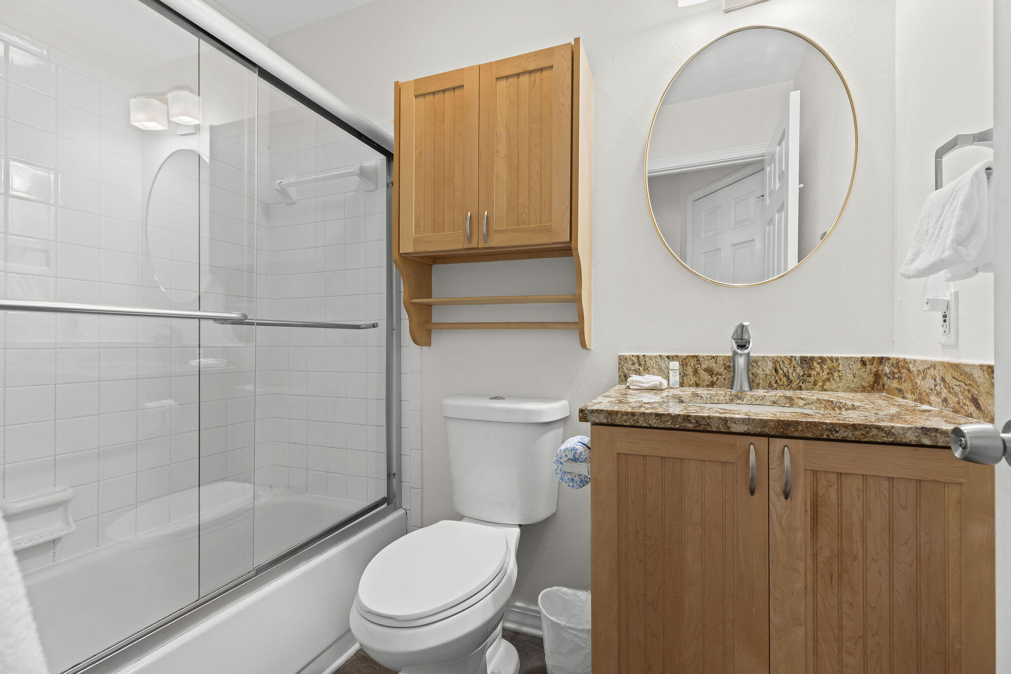 91 Matthew Boulevard Destin, FL 32541 - Photo 40 of 85 a bathroom with a granite countertop toilet a sink and a mirror