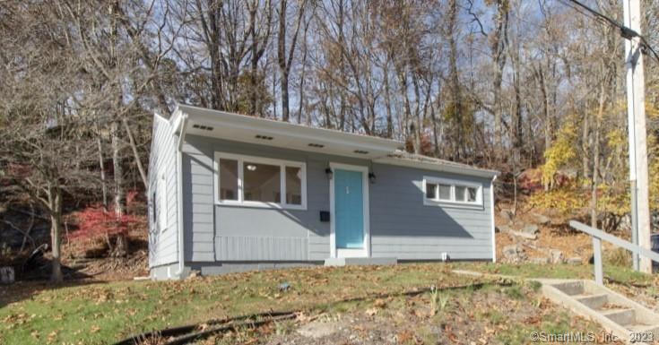 a view of house with yard