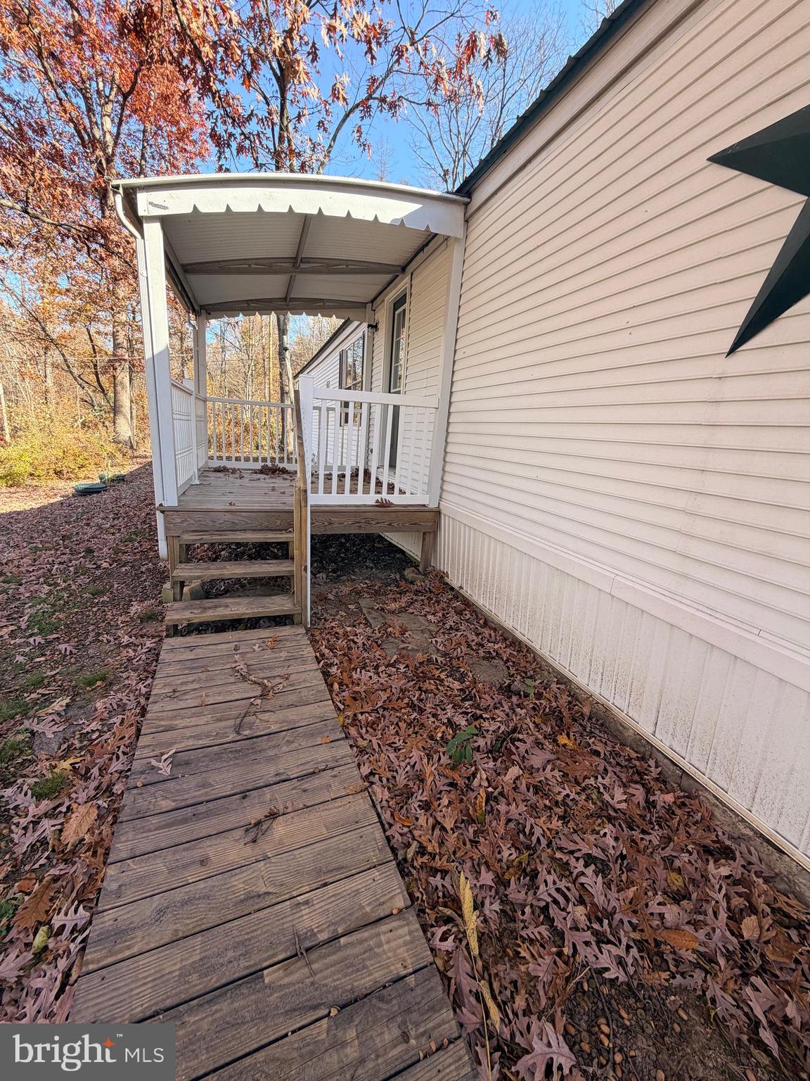 451 Upper Bailey Road Newport, PA 17074 - Photo 3 of 25 a view of a pathway door with wooden fence