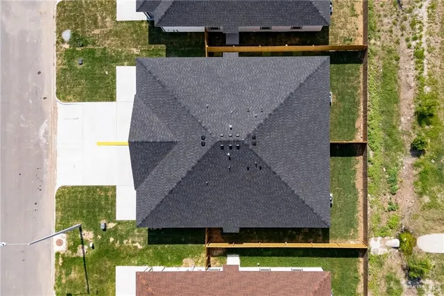 an aerial view of house with yard
