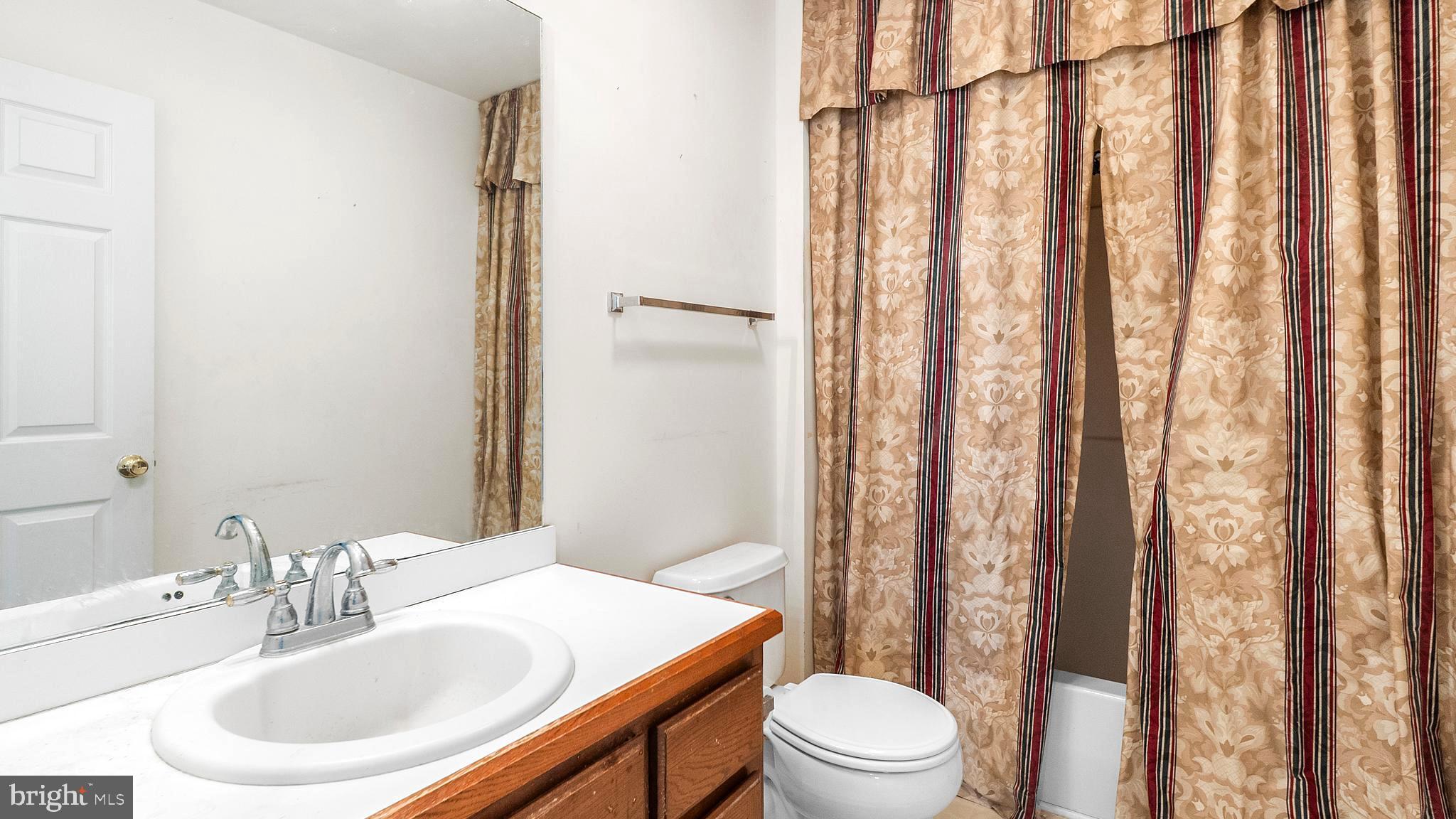 34157 Somerset Road Pocomoke City, MD 21851 - Photo 15 of 39 a bathroom with a sink toilet and shower