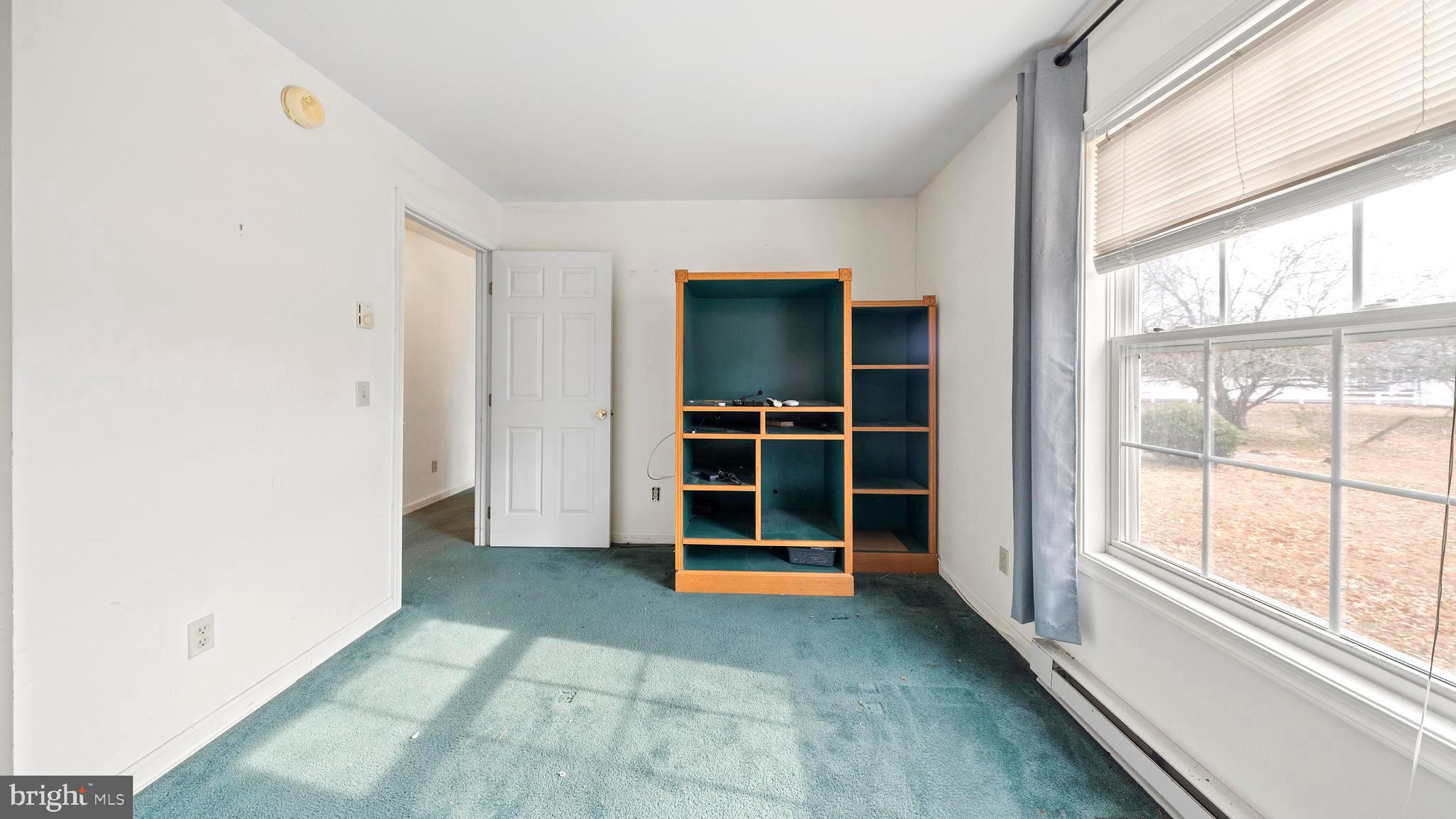 34157 Somerset Road Pocomoke City, MD 21851 - Photo 19 of 39 a view of an empty room with a window and fire place