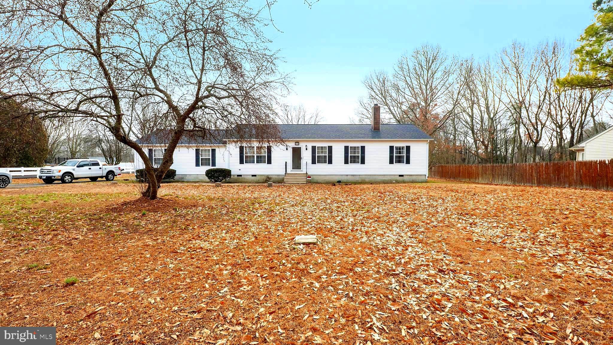 34157 Somerset Road Pocomoke City, MD 21851 - Photo 2 of 39 a front view of a house with a yard