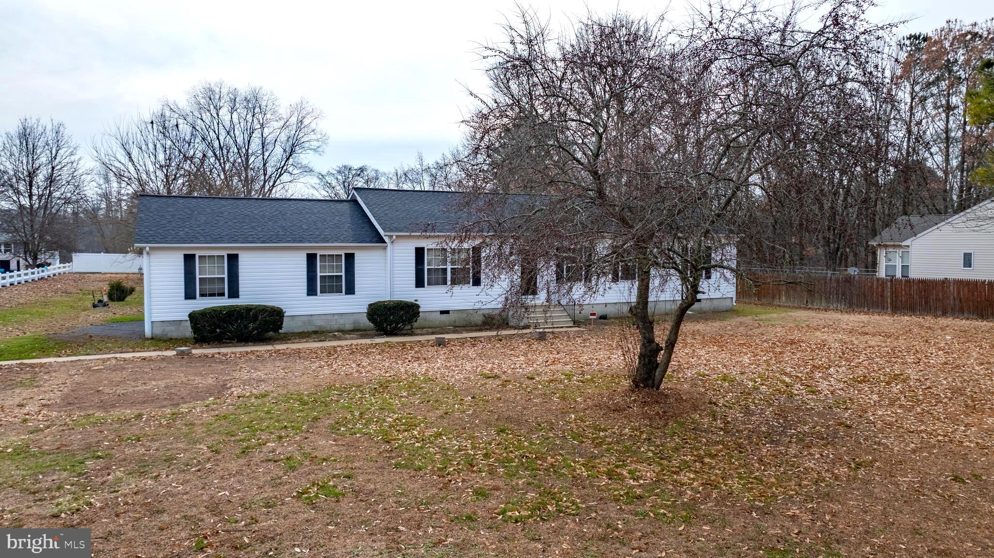 34157 Somerset Road Pocomoke City, MD 21851 - Photo 36 of 39 a front view of a house with yard covered in snow