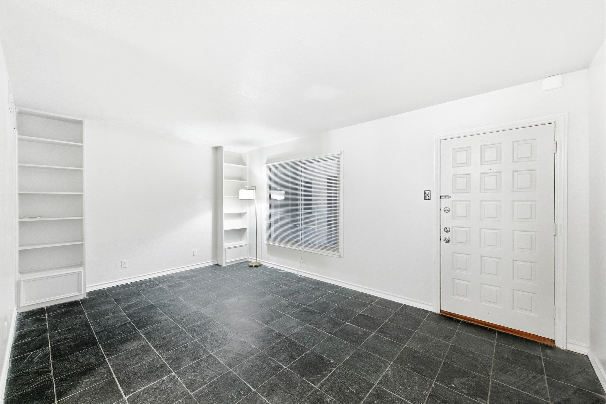 505 West 7th Street, Unit 106 Austin, TX 78701 - Photo 4 of 21 Entrance foyer with baseboards