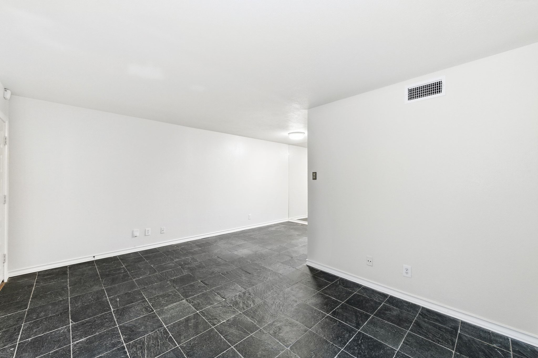 505 West 7th Street, Unit 106 Austin, TX 78701 - Photo 6 of 21 Spare room featuring baseboards