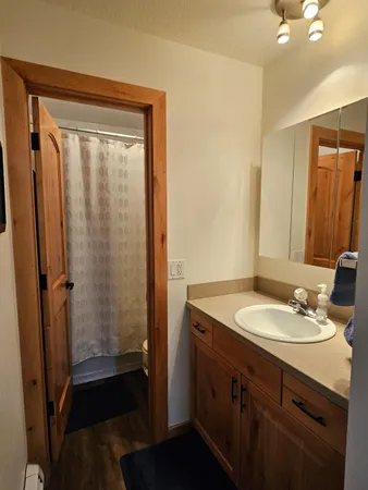 a bed sitting in a room next to a window
