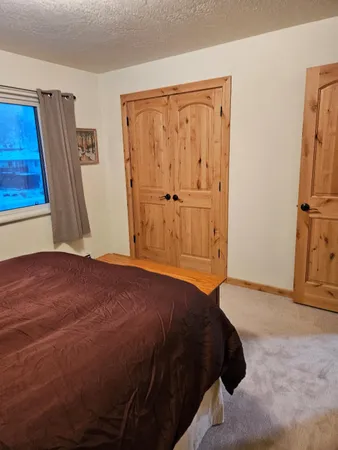a bathroom with a sink a mirror and a shower