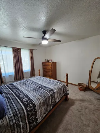 a bedroom with a bed and cabinets