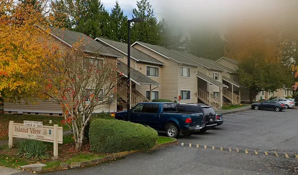 a view of a car park in front of house