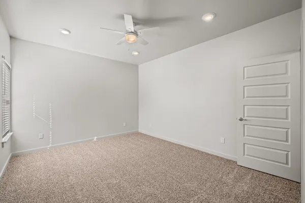 an empty room with a hallway