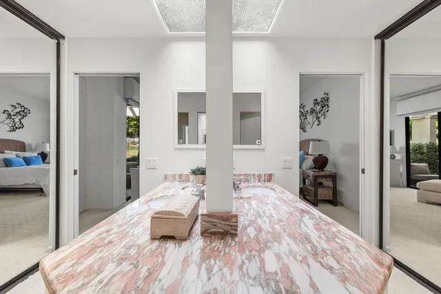 a bedroom with furniture and a wooden floor