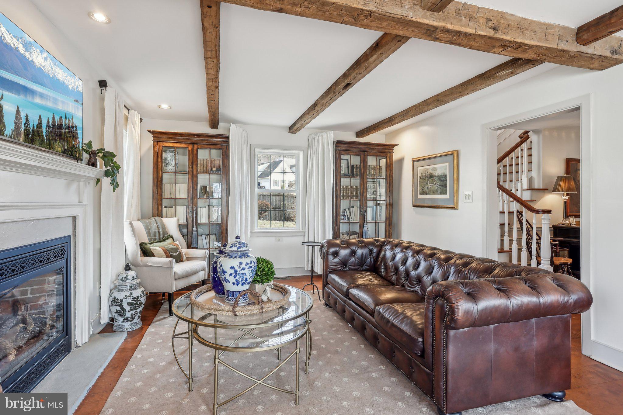 1660 St Peters Road Pottstown, PA 19465 - Photo 24 of 80 a living room with furniture and a fireplace