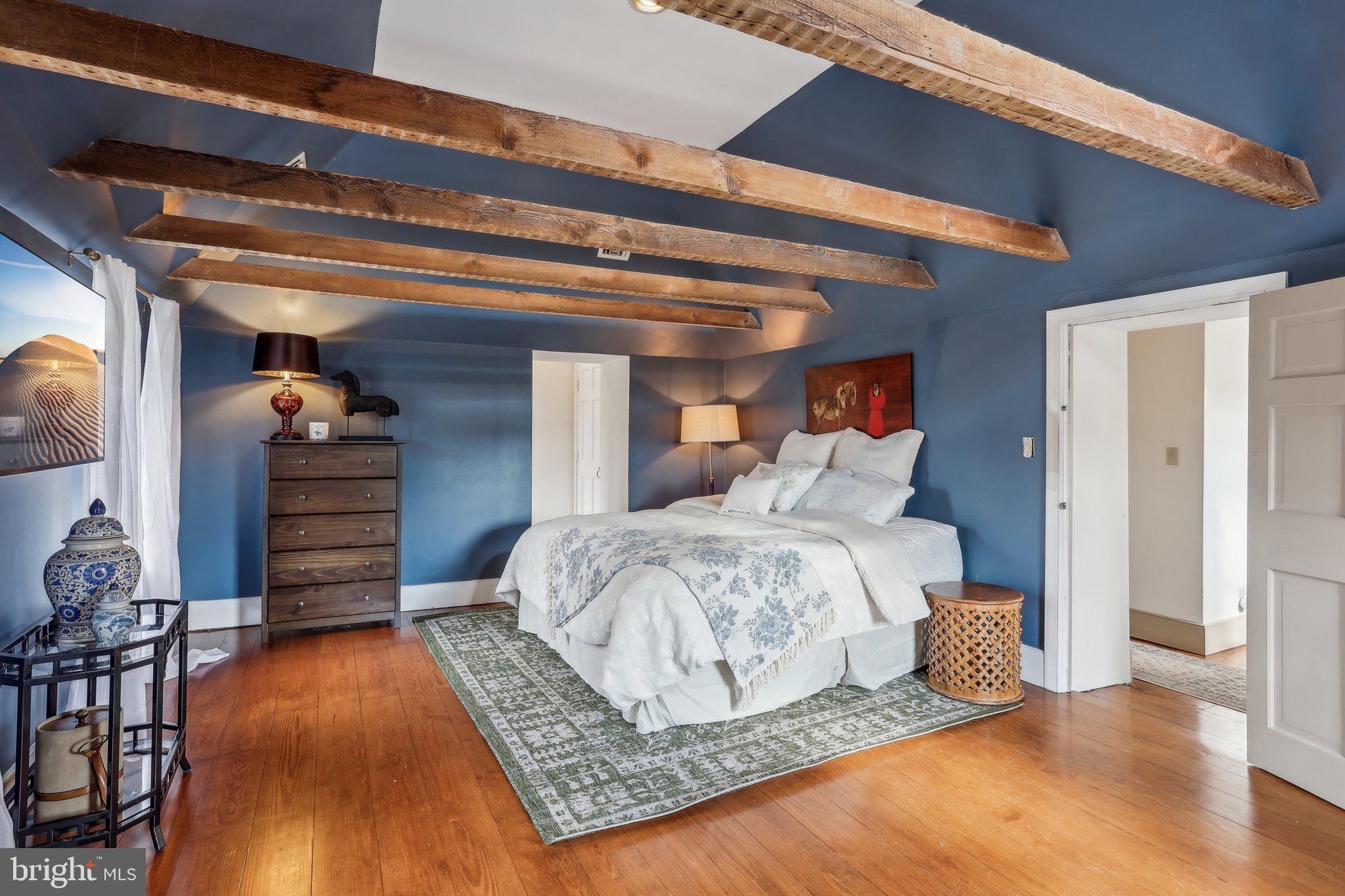 1660 St Peters Road Pottstown, PA 19465 - Photo 32 of 80 a bedroom with a bed and wooden floor