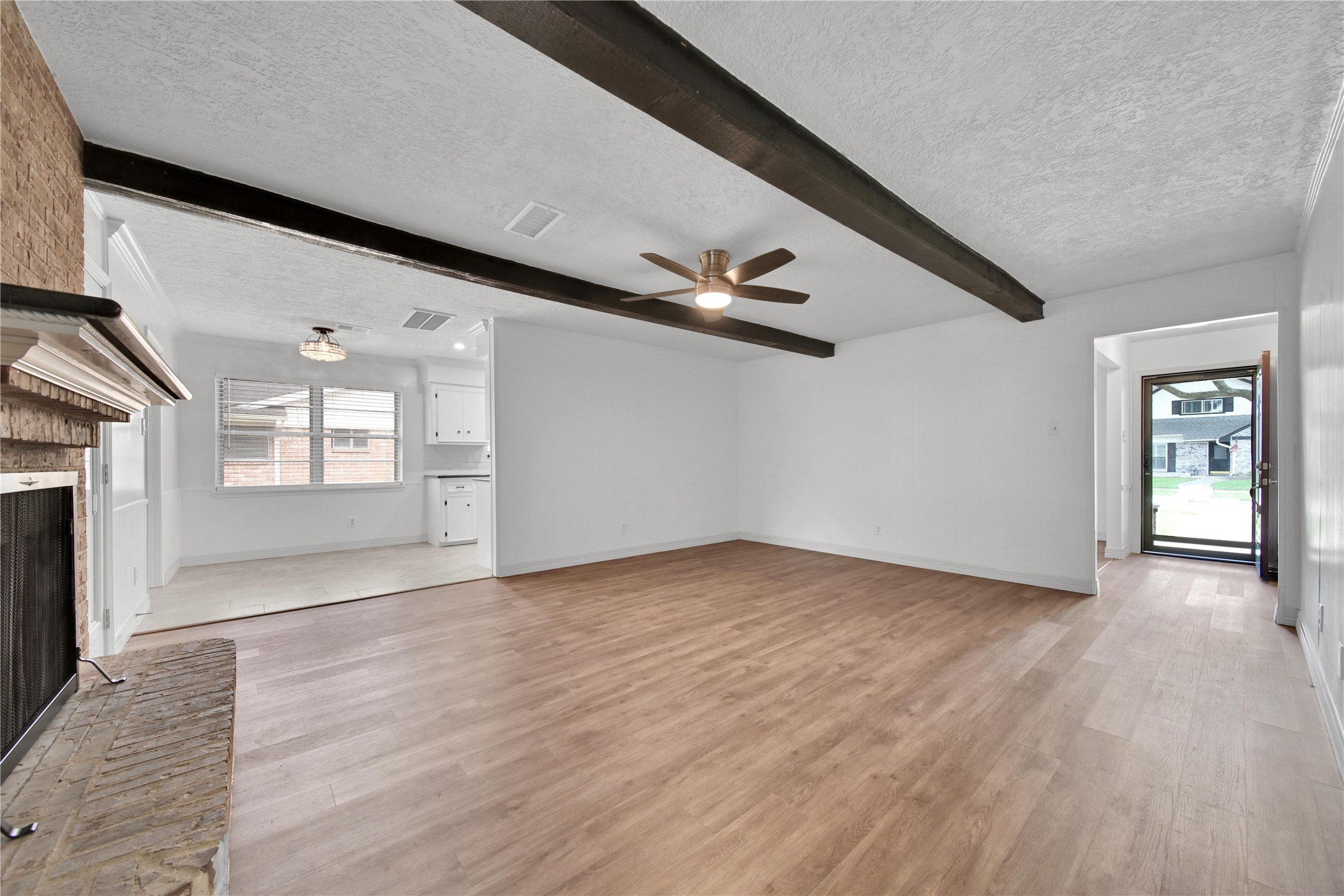 9411 Roos Road Houston, TX 77036 - Photo 41 of 41 a view of an empty room with window and wooden floor