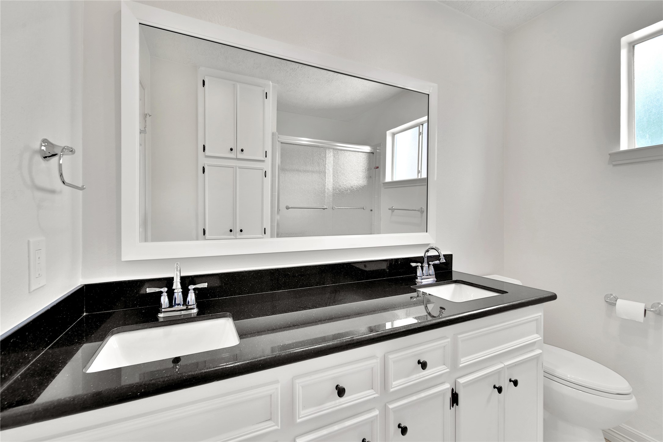 9411 Roos Road Houston, TX 77036 - Photo 35 of 41 a bathroom with a sink and a toilet