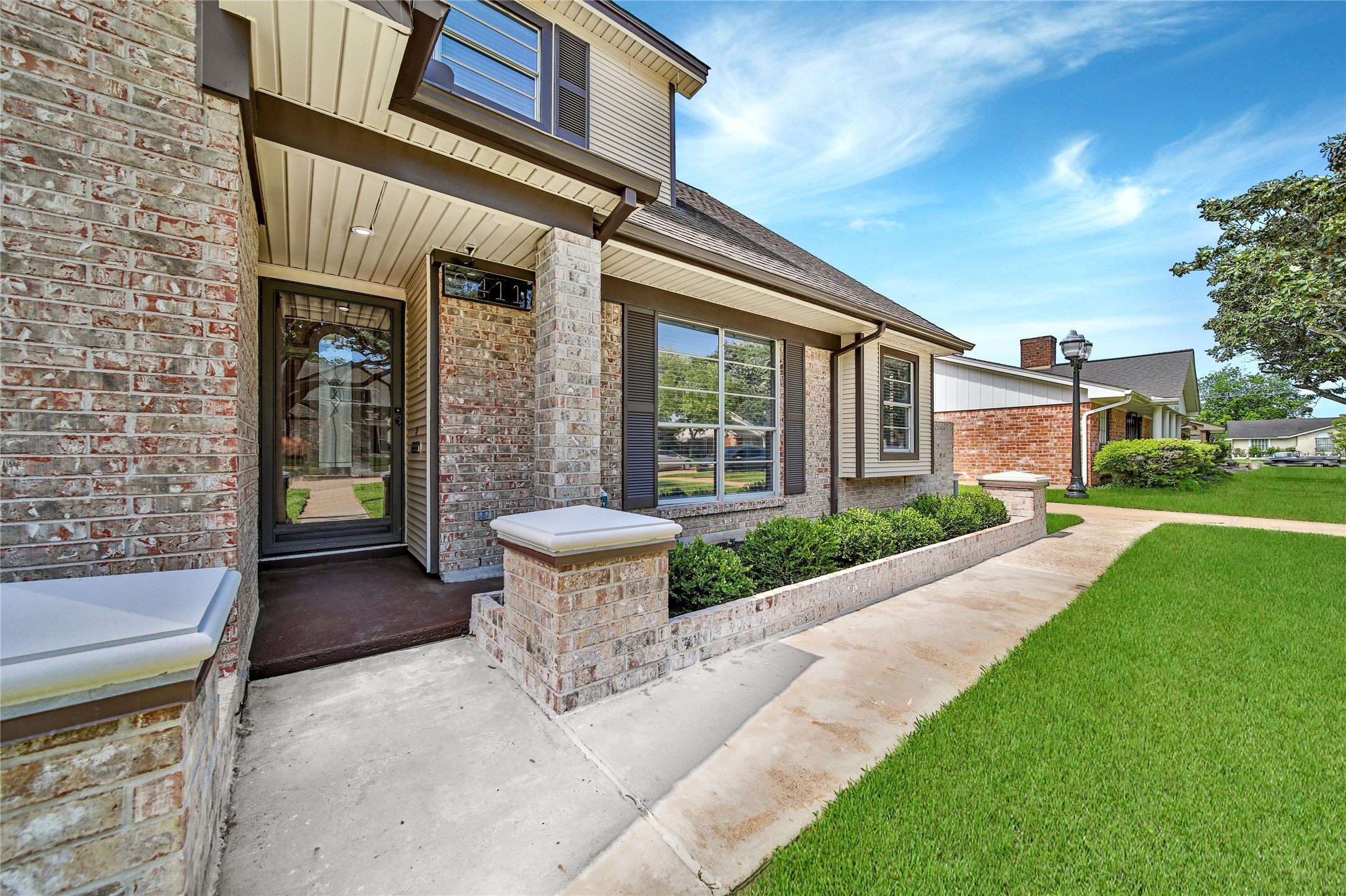 9411 Roos Road Houston, TX 77036 - Photo 4 of 41 a view of a house with a yard