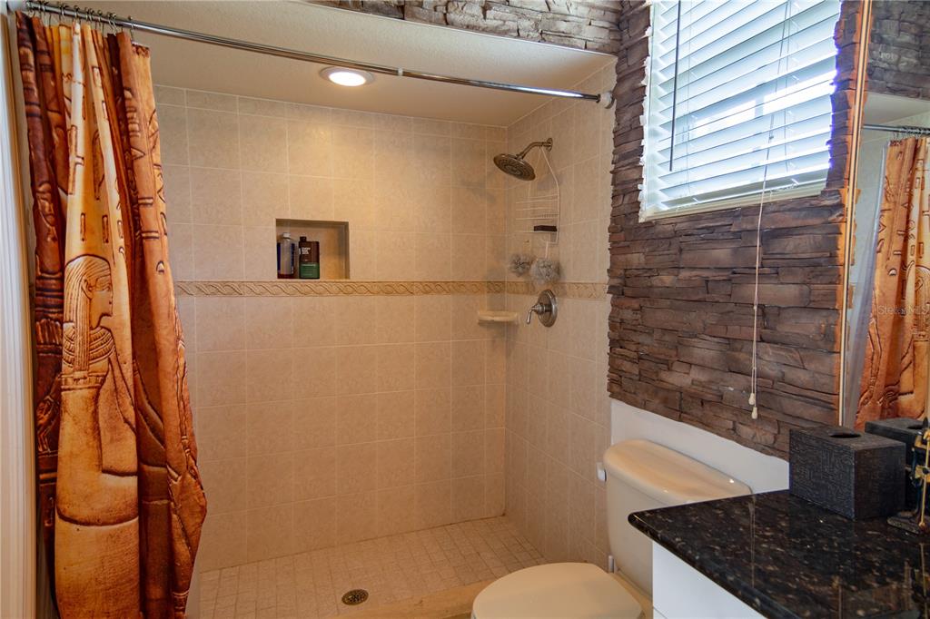 6151 New Osprey Point Weeki Wachee, FL 34607 - Photo 20 of 63 a bathroom with a sink and a shower