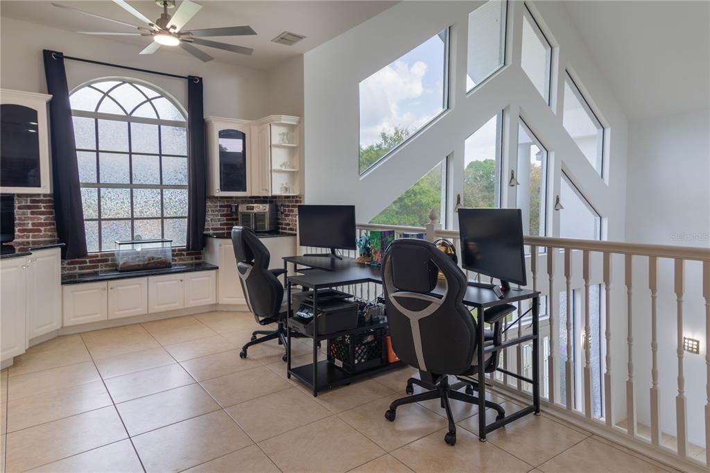 6151 New Osprey Point Weeki Wachee, FL 34607 - Photo 24 of 63 a view of a workspace with furniture and a window