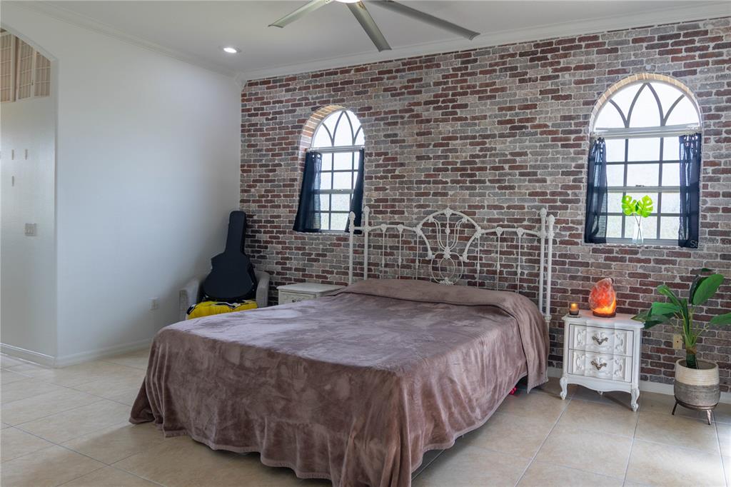 6151 New Osprey Point Weeki Wachee, FL 34607 - Photo 39 of 63 a bedroom with a bed and a window