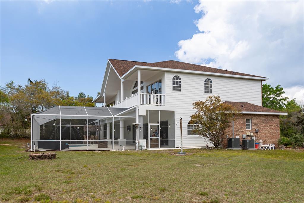 6151 New Osprey Point Weeki Wachee, FL 34607 - Photo 47 of 63 a view of a house with a garden and yard