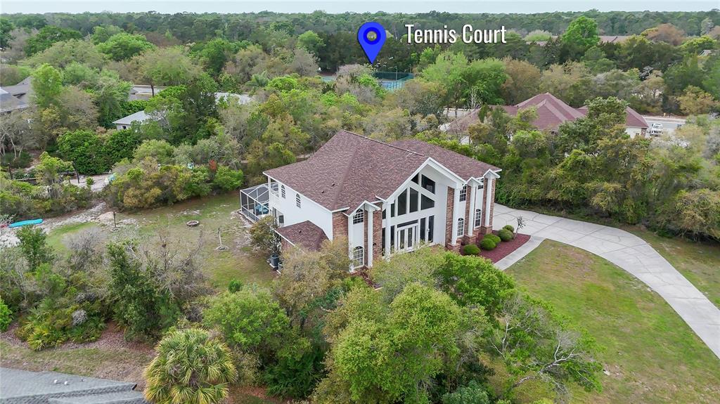 6151 New Osprey Point Weeki Wachee, FL 34607 - Photo 51 of 63 an aerial view of a house