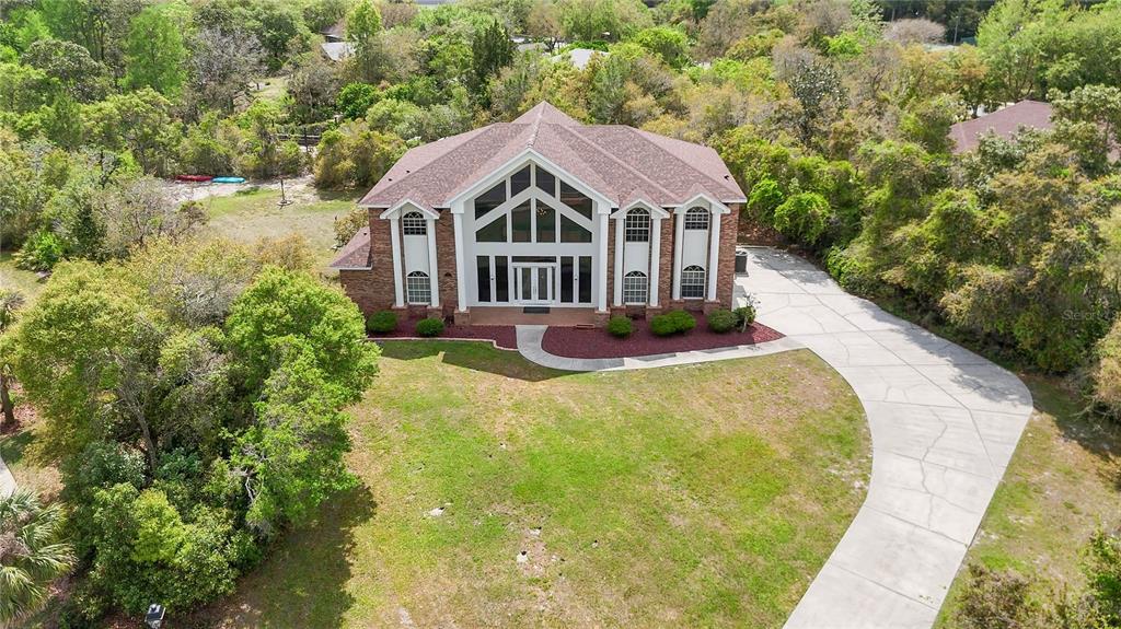 6151 New Osprey Point Weeki Wachee, FL 34607 - Photo 55 of 63 a view of a house with swimming pool