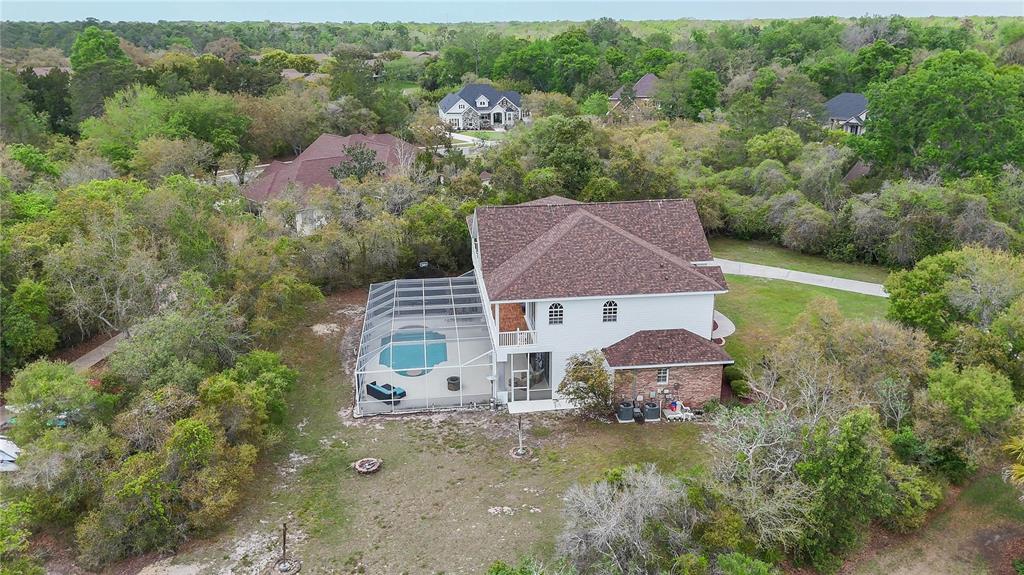 6151 New Osprey Point Weeki Wachee, FL 34607 - Photo 56 of 63 an aerial view of a house