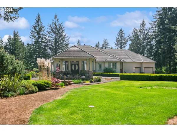 a front view of a house with swimming pool having outdoor seating