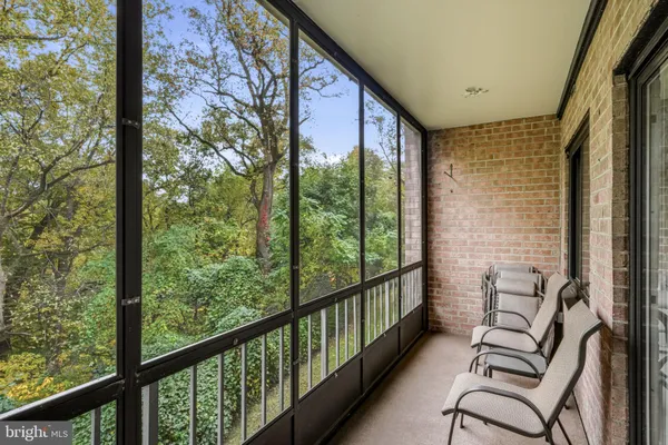 a view of a floor to ceiling window with wooden floor