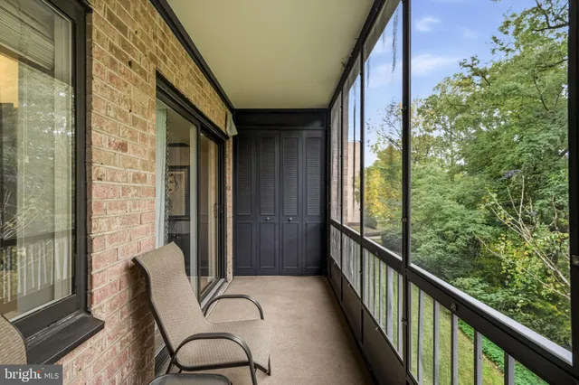 a view of a balcony with furniture