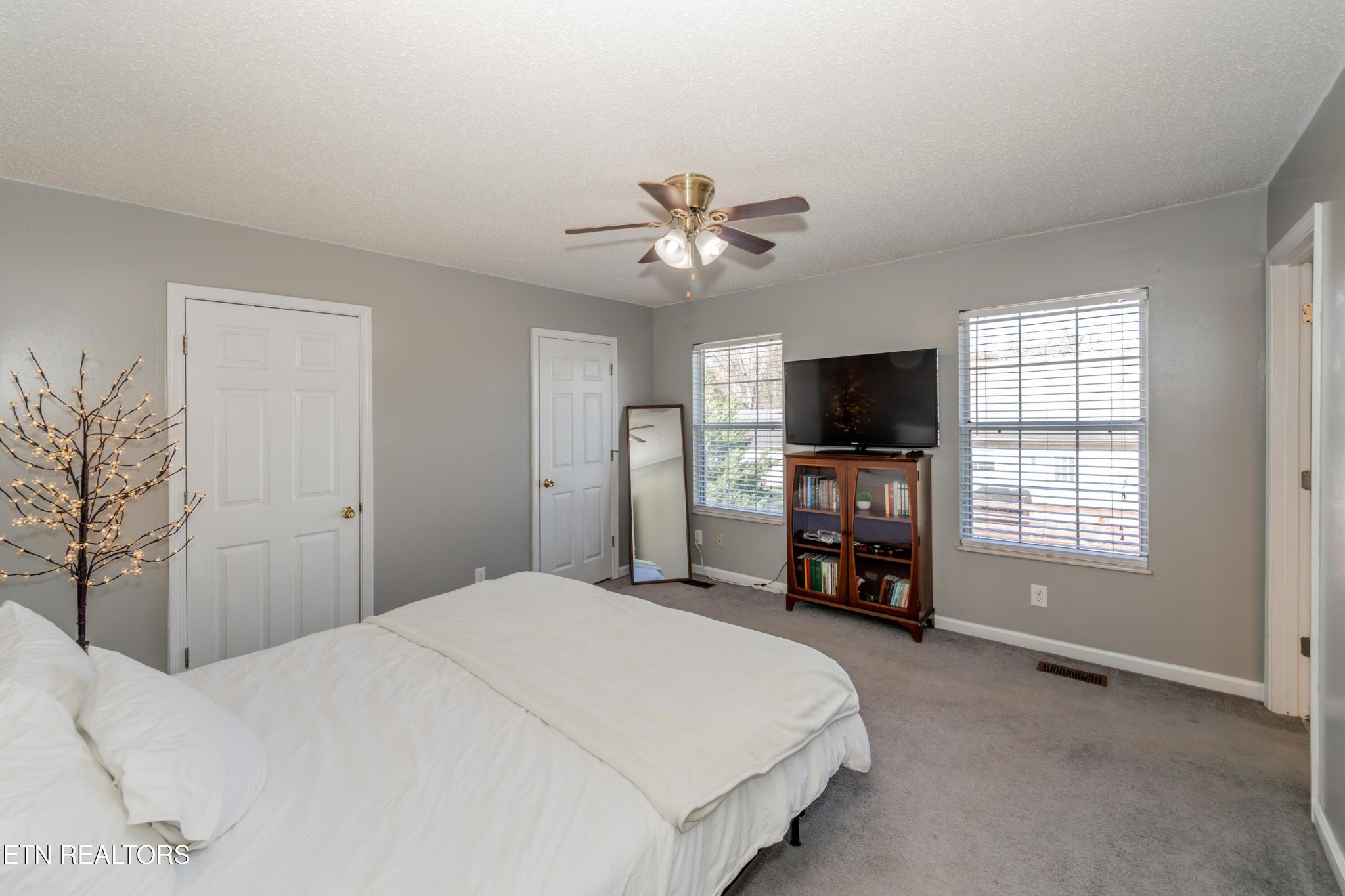 3919 Morganton Road Maryville, TN 37801 - Photo 21 of 29 a bedroom with a large bed and a tv