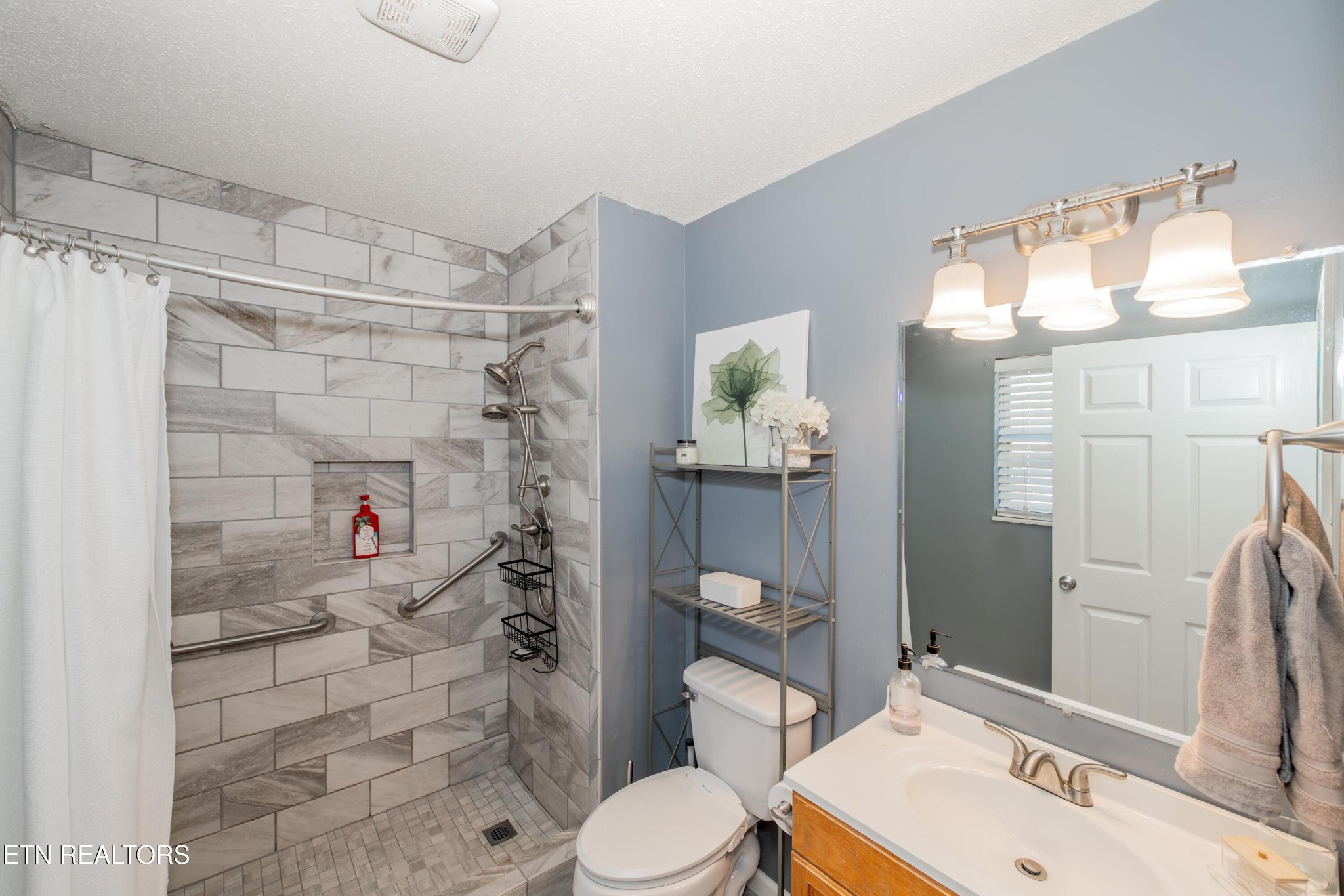 3919 Morganton Road Maryville, TN 37801 - Photo 23 of 29 a bathroom with a sink toilet and shower